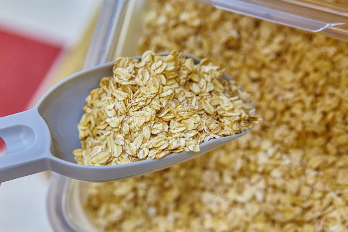 scooping oats in a health food store