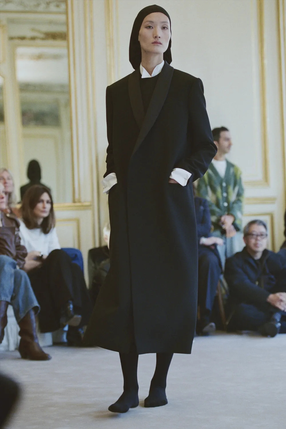 A model during the row resort 2026 show wears cashmere tights.