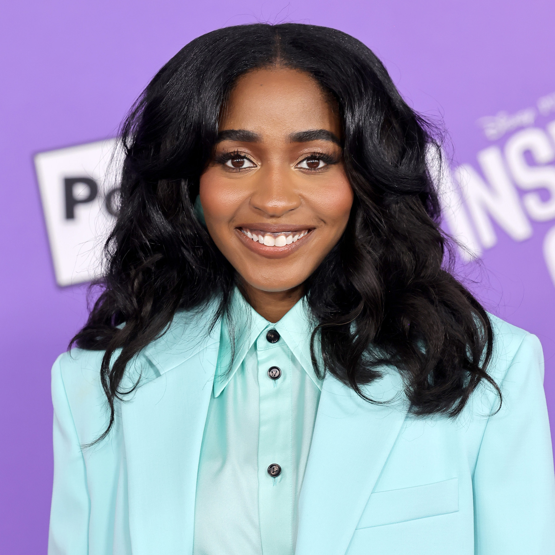 Ayo Edebiri attends the world premiere of Inside Out 2 wearing matte, brown lips and bold brows