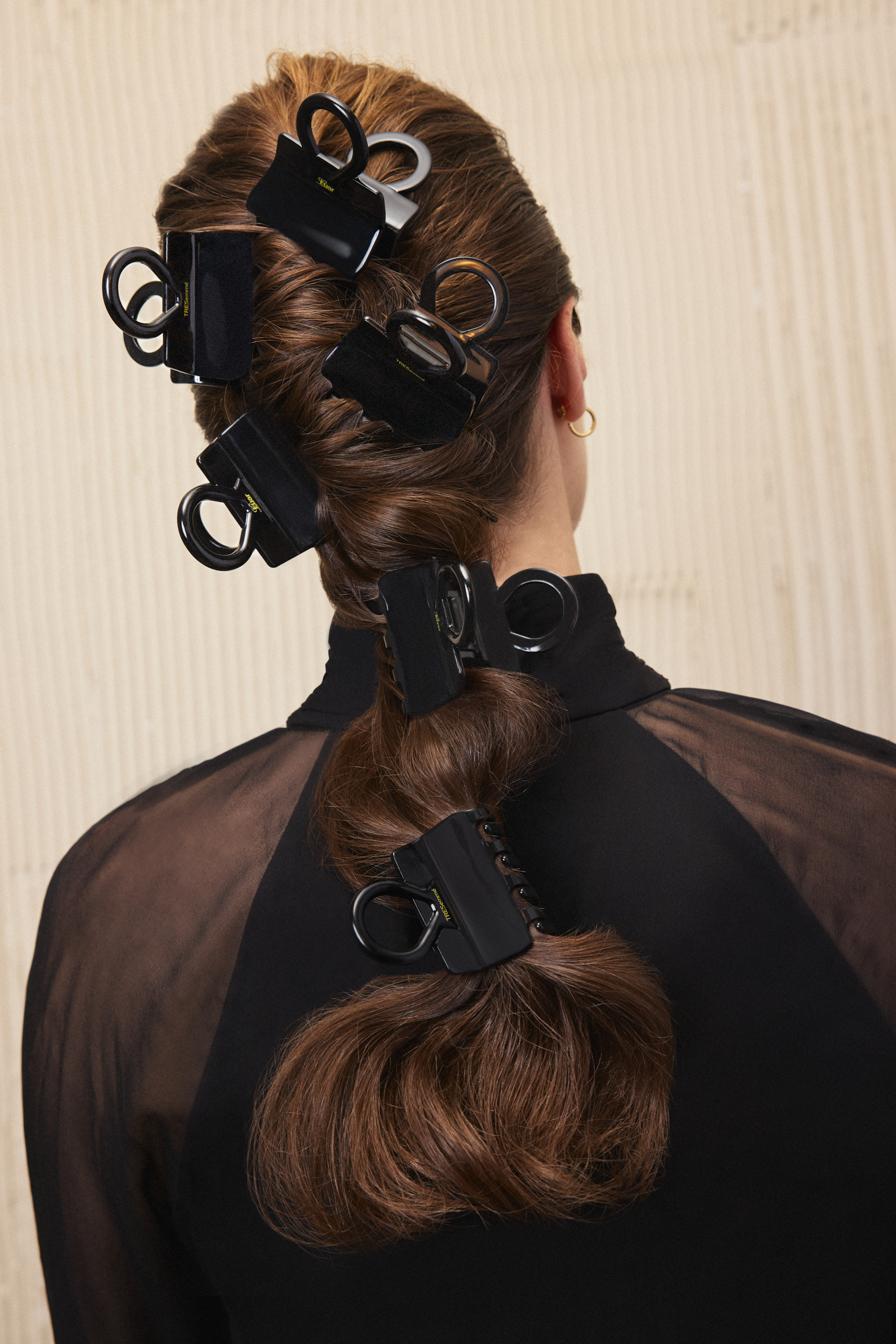 Photo of a model wearing multiple TreSemm&eacute; x Luar claw clips