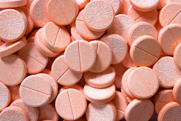 Vitamin C orange tablets background