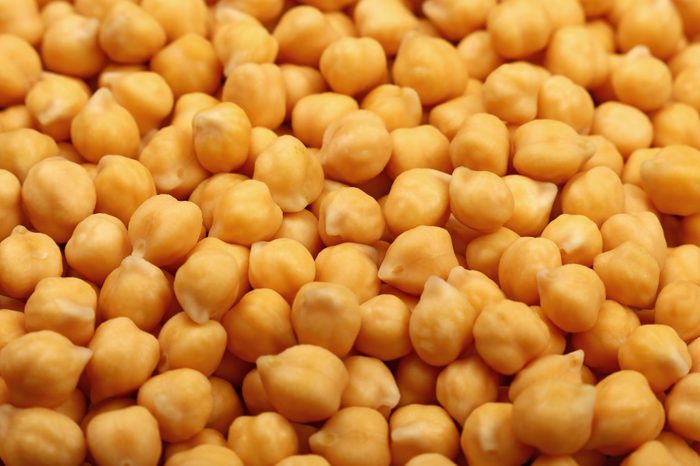 Cooked soaked chickpea beans close up background