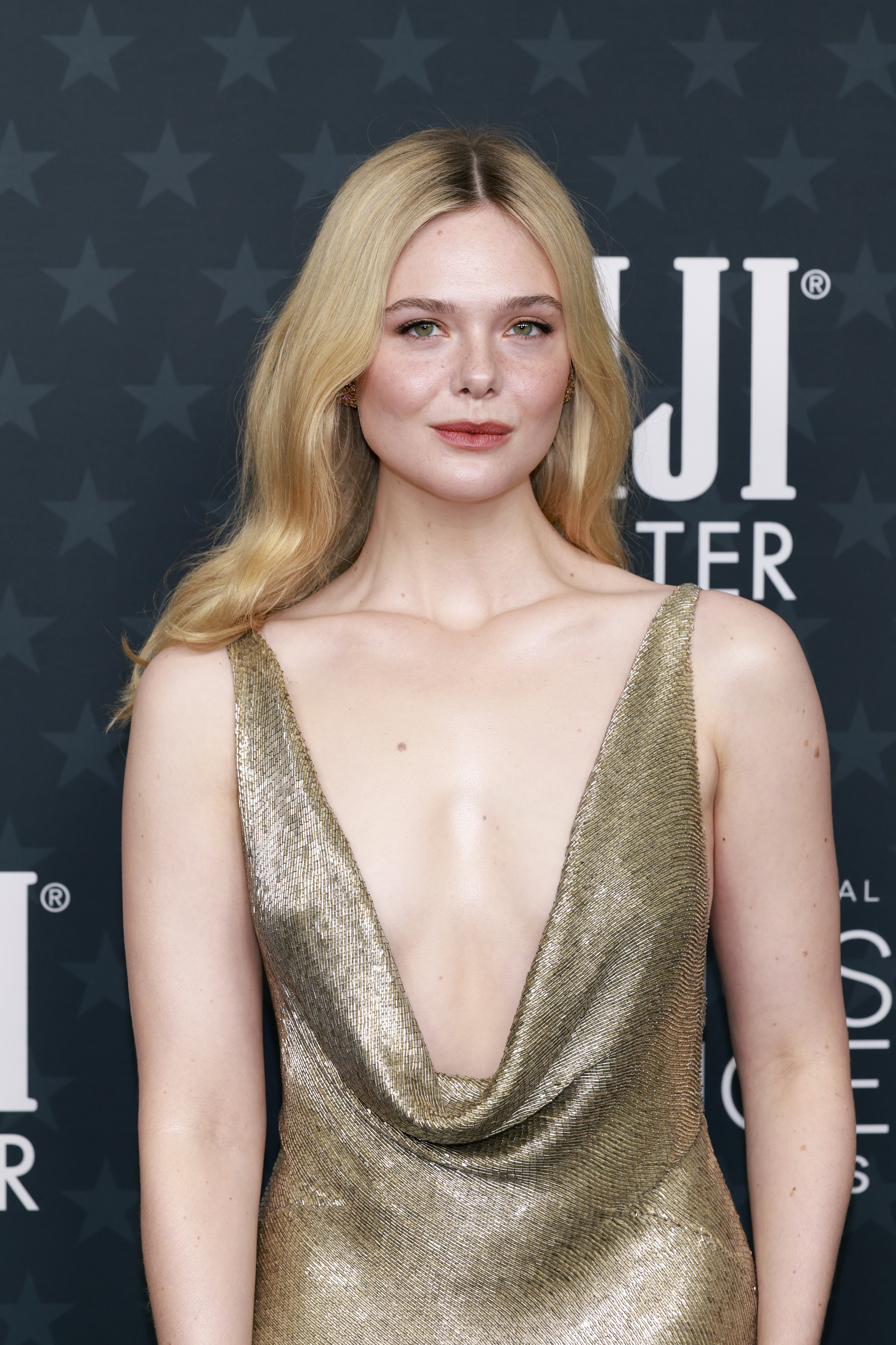 Elle Fanning in long gold gown at the 2026 Critics Choice Awards