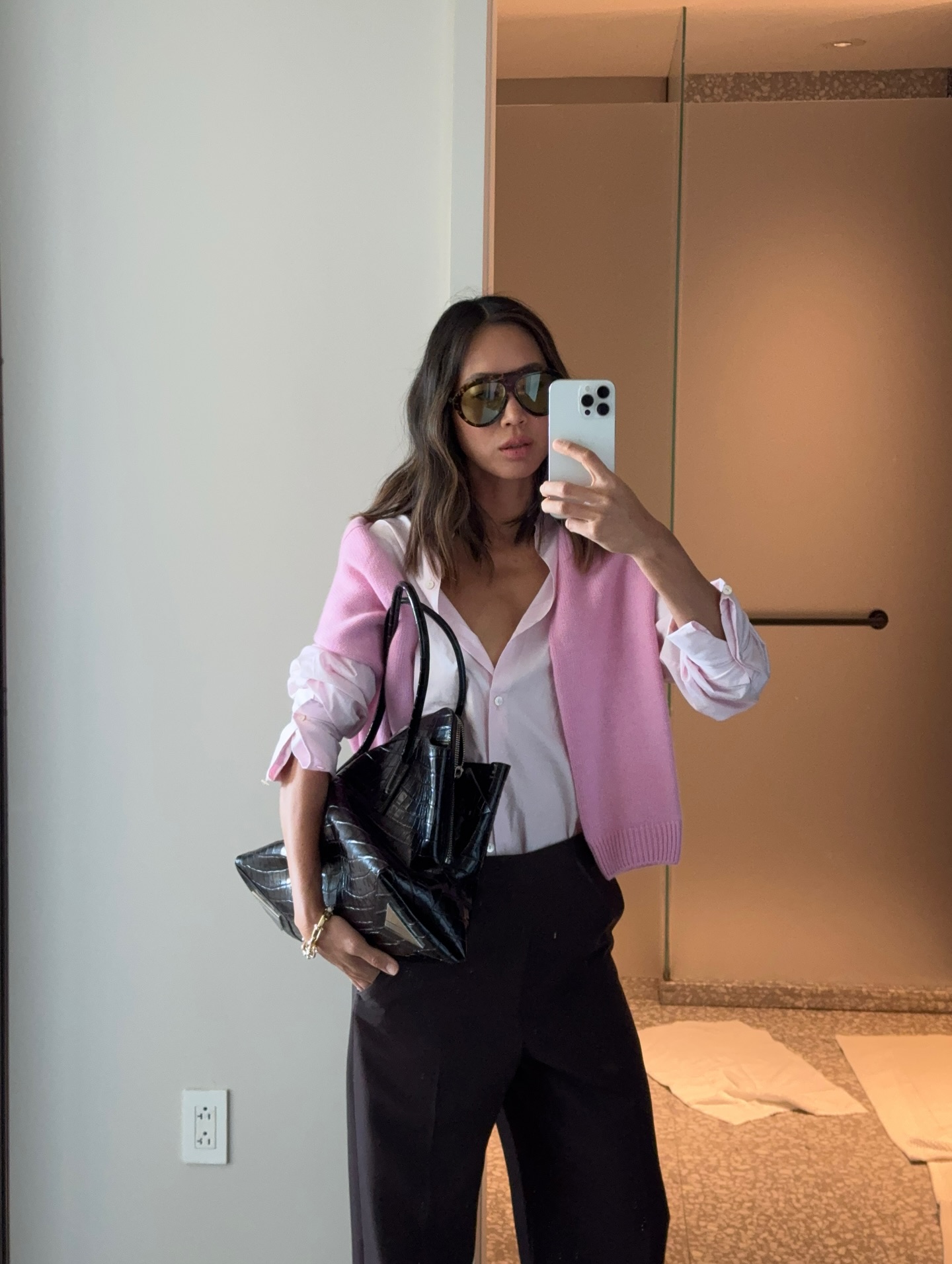 Woman in pale pink shirt and jeans.