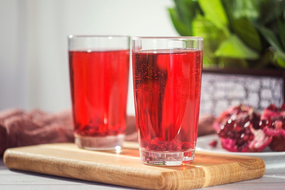 Pomegranate Juice In A Glass And Ripe Pomegranate