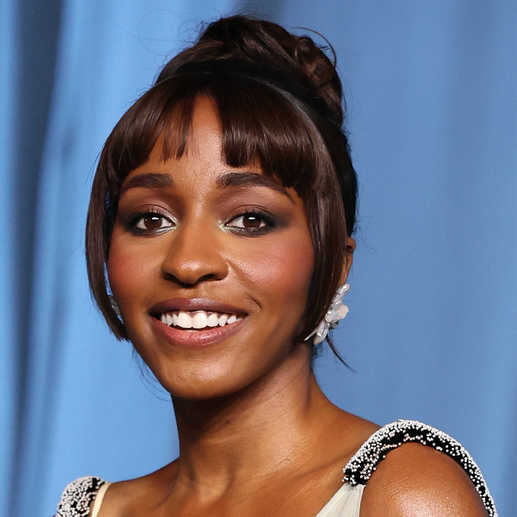 Ayo Edebiri Attending the fifth annual Academy Museum Gala wearing berry-toned cheeks and frosty shimmer on the inner corners of her eyes