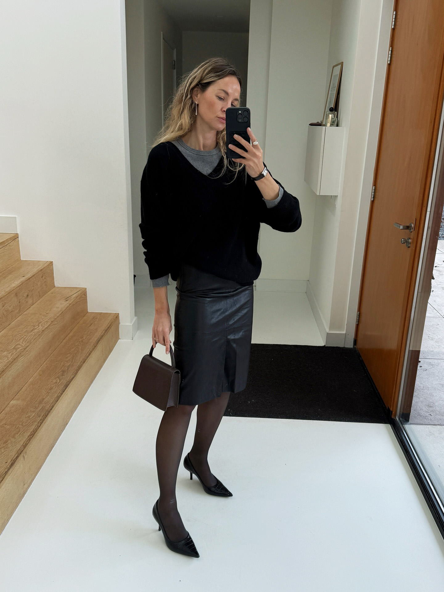 Influencer wearing classic black pumps.