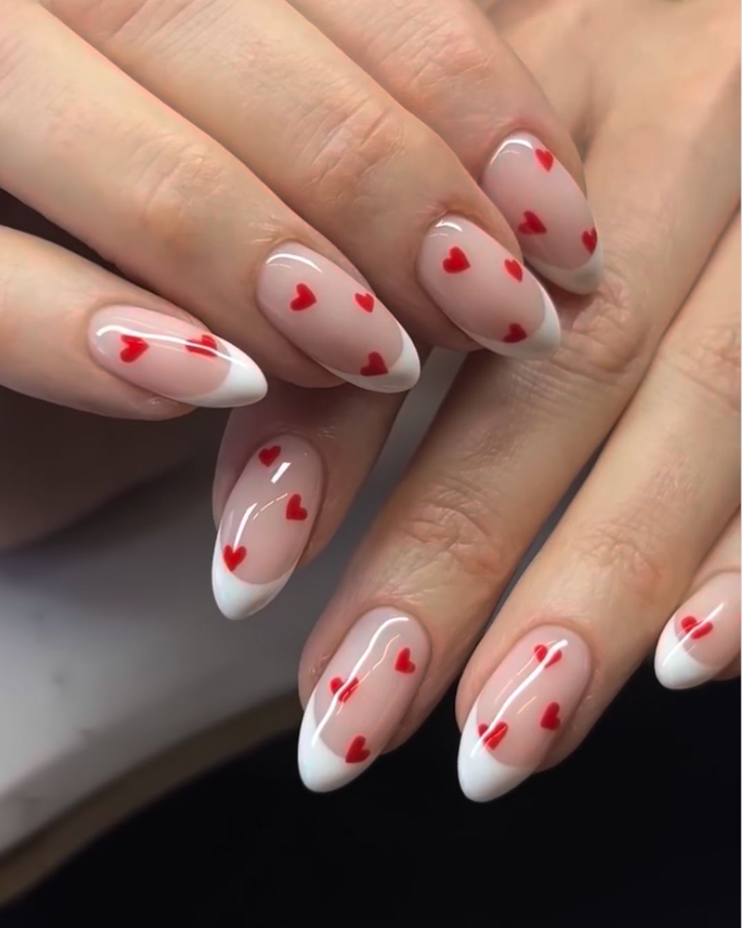 French nails with hearts.