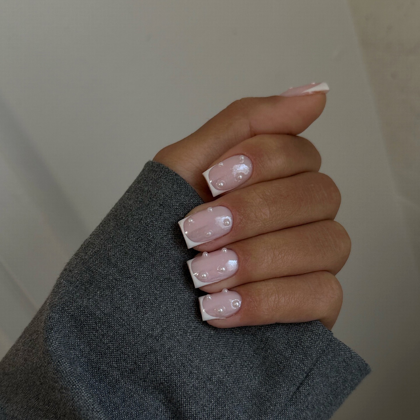 French manicure with pearl decals.