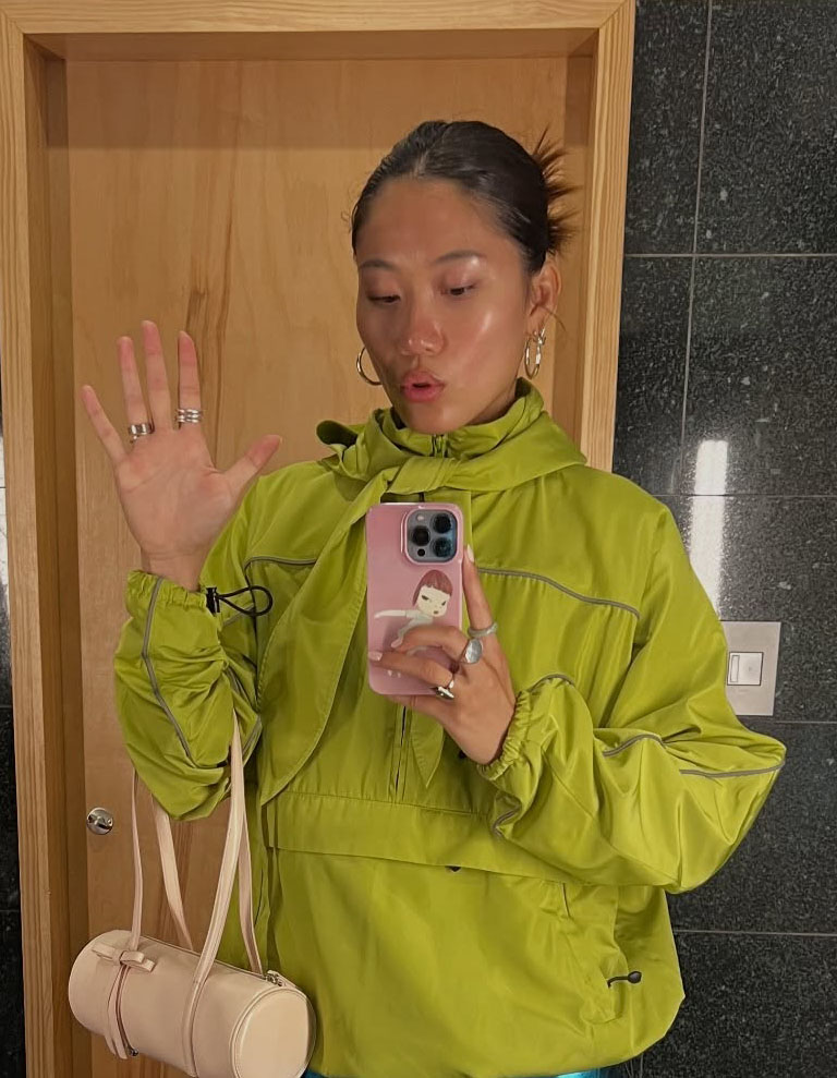 Woman in green sweater.