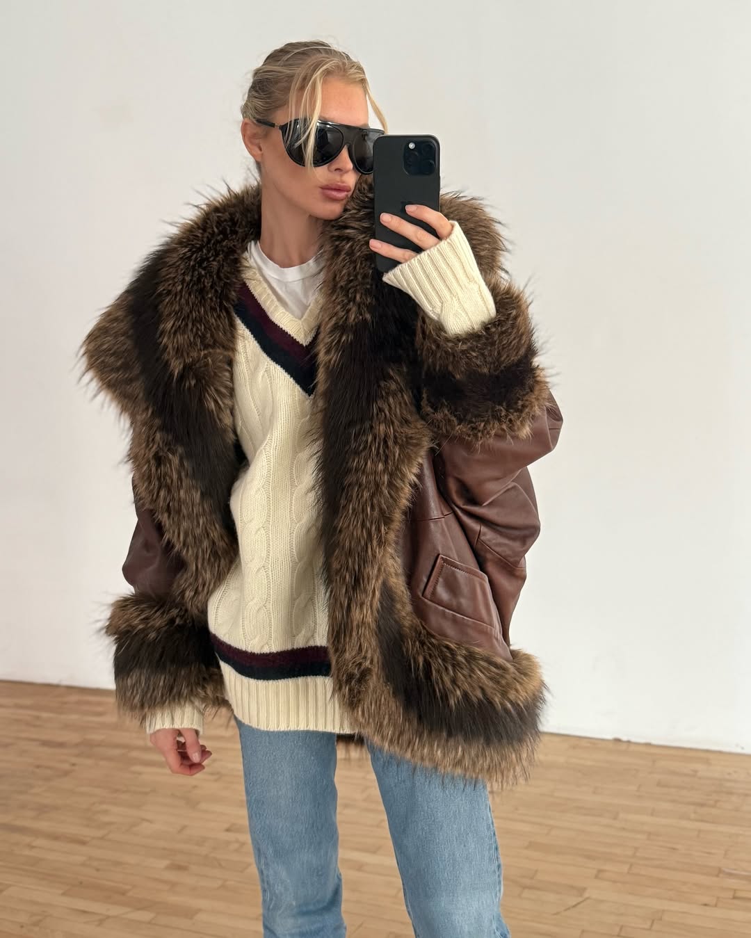Woman wearing brown faux fur coat 2026.