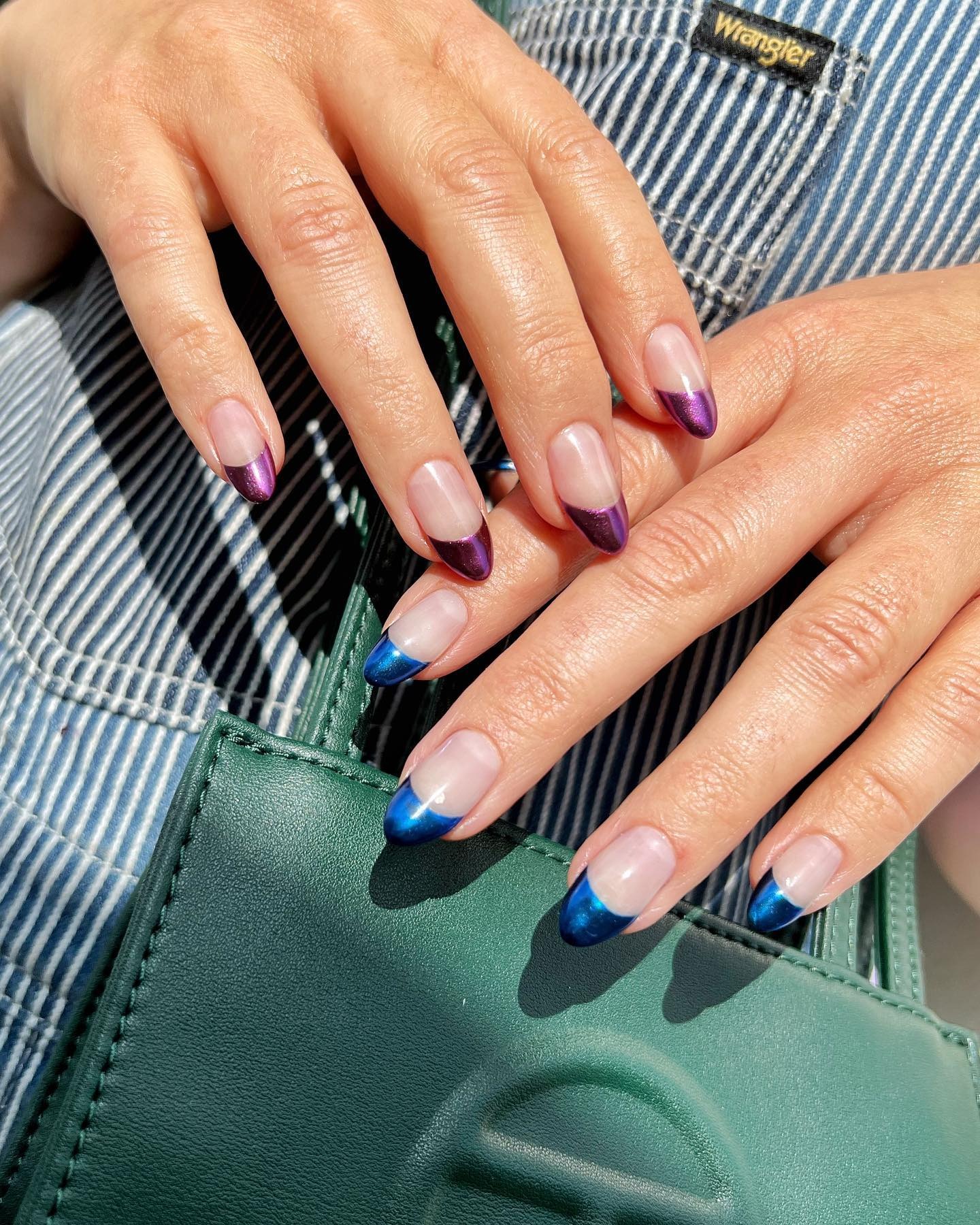 Photo of a dark purple chrome French nail design