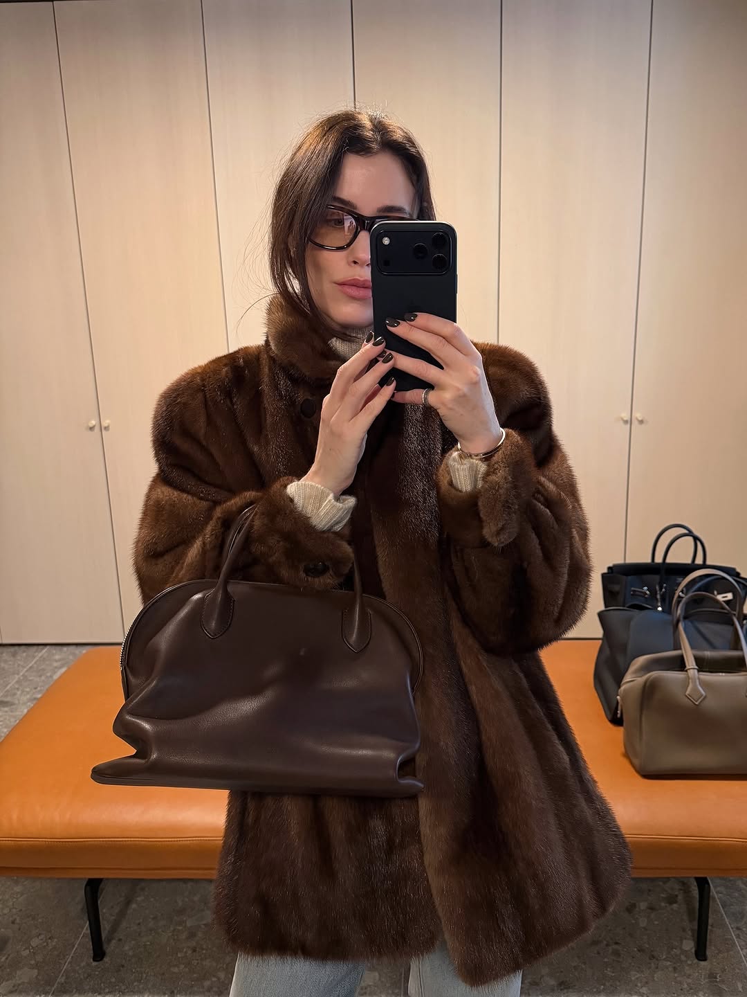 Woman wearing brown faux fur coat 2026.