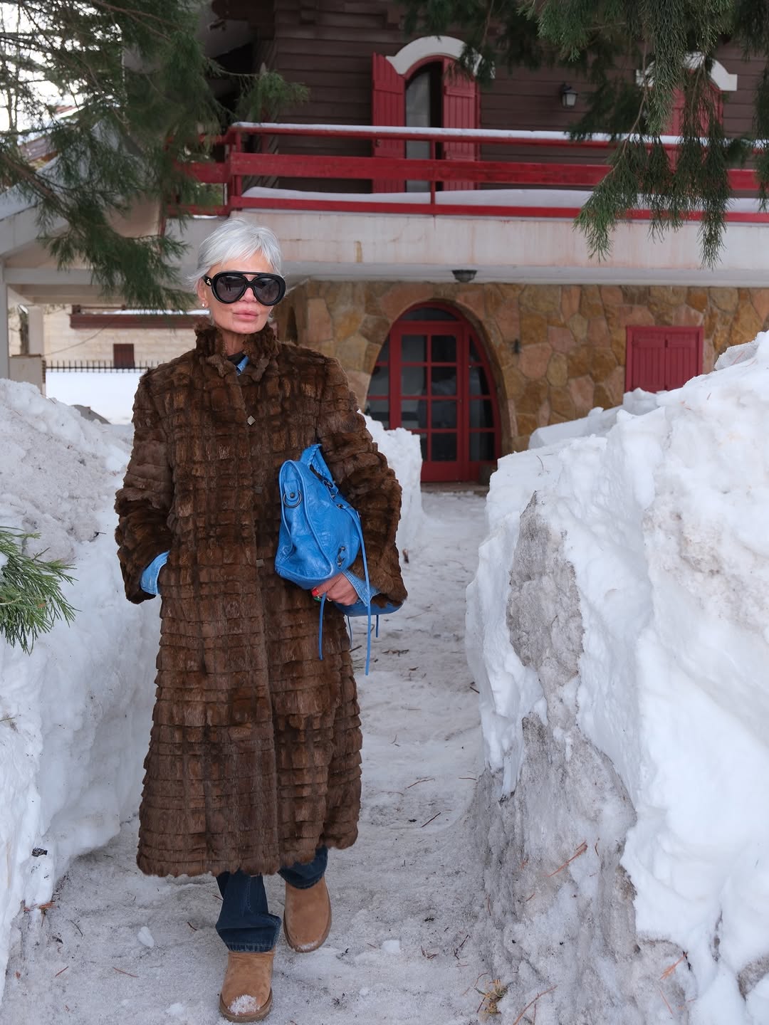 Woman wearing brown faux fur coat 2026.