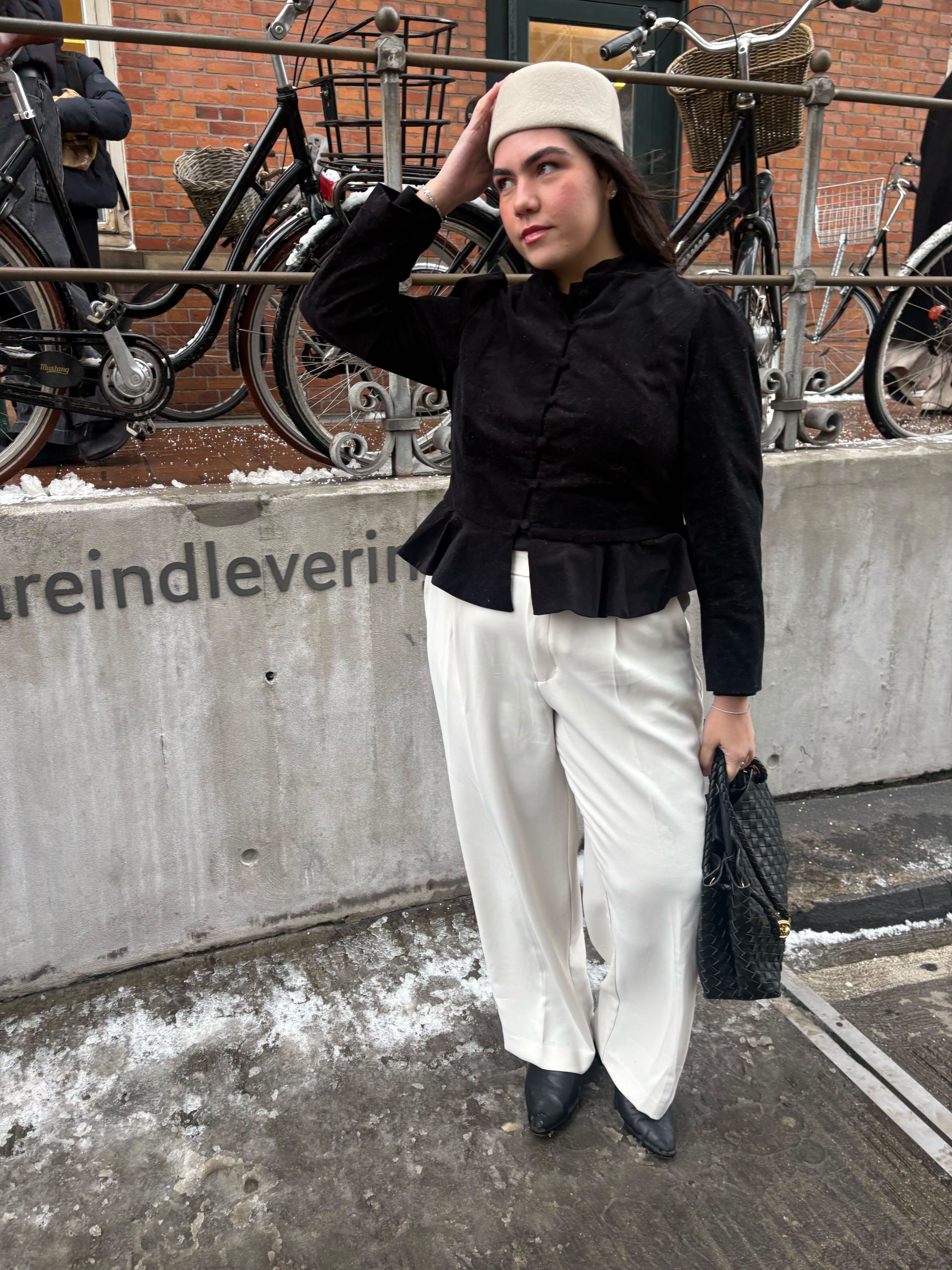 Who What Wear editor Ana Escalante wears a pillbox hat.