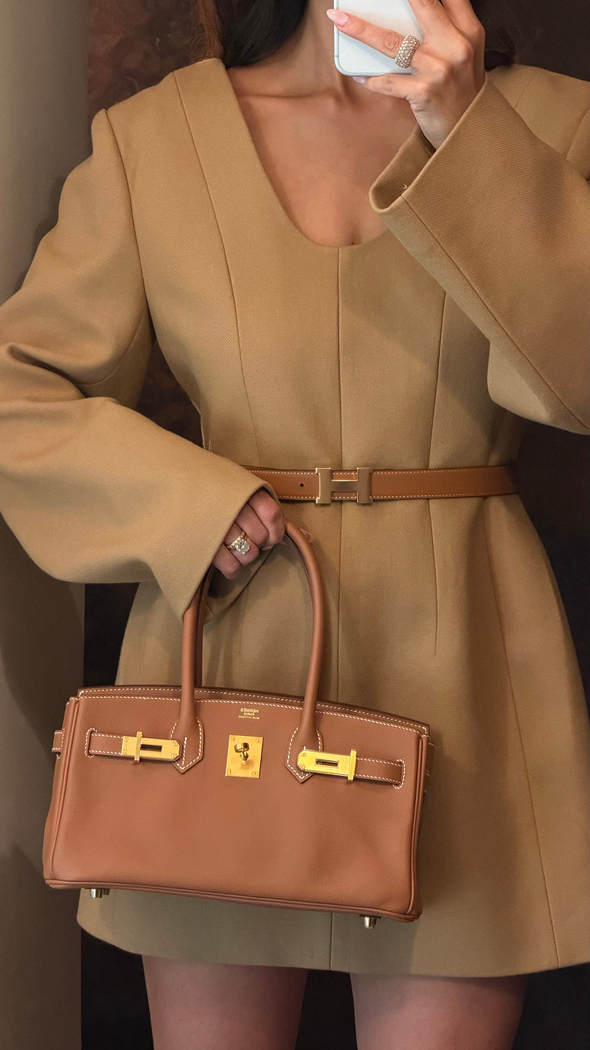 Bettina Looney wearing a camel Carven dress and an Hermes bag