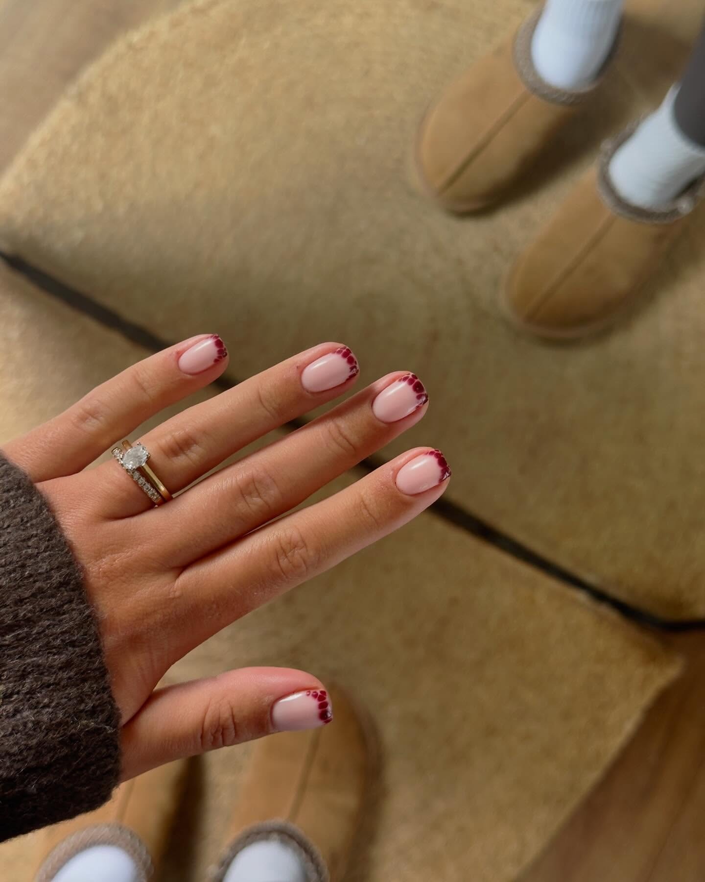 Photo of a dark purple French nail design