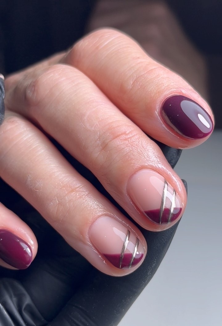 Photo of a dark purple French nail design