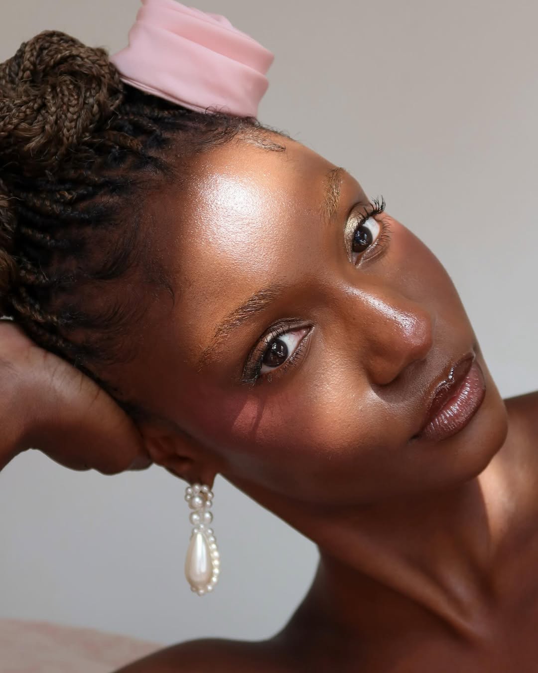 Camri Hewie with pink blush, glossy lips, and a glowy complexion